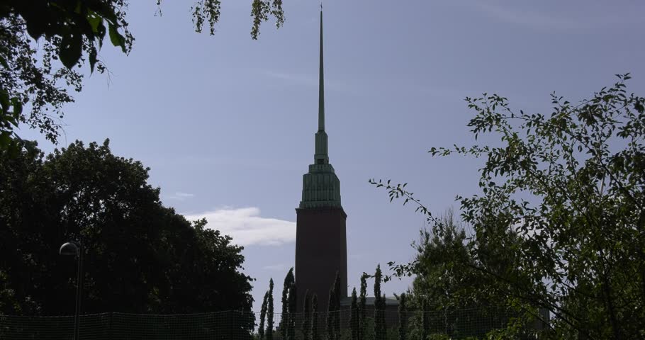 4K high quality bright summer morning video of Mikael Agricola Church located in Punavuori and Eira area of Helsinki, the capital of Finland Suomi, northern Europe. The church tower is 103 m high