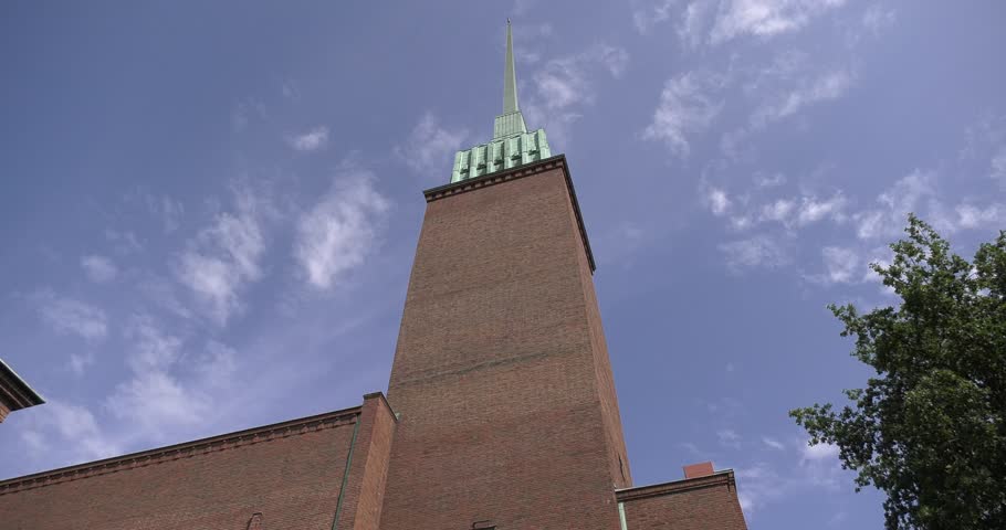 4K high quality bright summer morning video of Mikael Agricola Church located in Punavuori and Eira area of Helsinki, the capital of Finland Suomi, northern Europe. The church tower is 103 m high