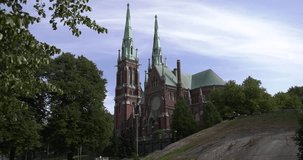 4K high quality bright summer morning video of St. John's Church located in Punavuori and Ullanlinna area of Helsinki, the capital of Finland Suomi, northern Europe. Church twin towers are 74 m high