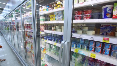 PHUKET, THAILAND - JANUARY 3, 2017: 
Refrigerators with dairy and frozen products in a "Tesco" hypermarket. Tesco plc is a British multinational grocerie.