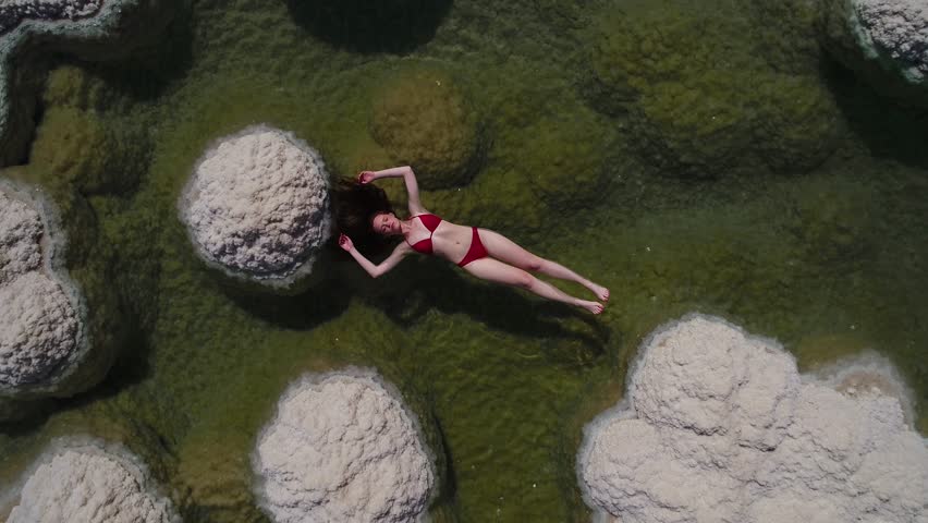 woman floating in the Dead Sea salt