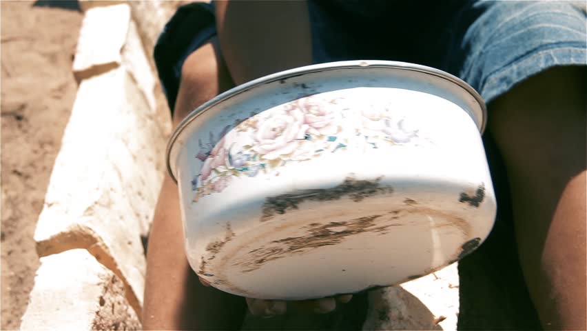 Child Pretending to Drive With Saucepan and Bricks, Close Up Hands, Argentina