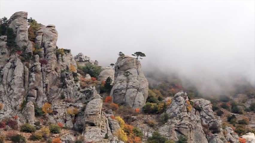 Beautiful landscape, mountain range rock formations. Shot. Adventure summer nature beauty. Mountain range among the clouds