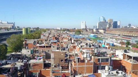 Buenos Aires fly travel past impoverished residential neighborhood 