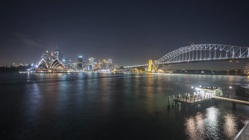 4k UHD time lapse of night scene at Sydney harbour. Tilt up