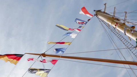 Harlingen, Friesland / Netherlands - 08 04 2018: Tall ship masts with flags attached