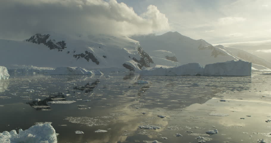 Floating ice bergs in Antarctica. Stunning imagery from the White Continent. Moving camera, calm scenes with beautiful light. Shot with RED Epic Dragon camera.