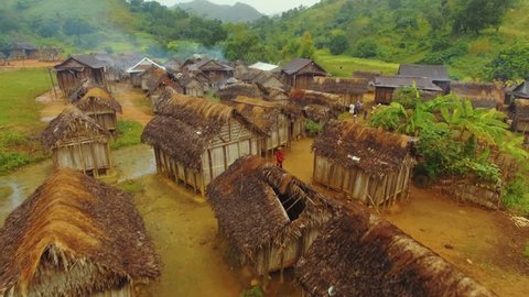 Manjakandriana , Madagascar - 05 02 2018: Aerial shot of rainforest village in Madagascar with poor wooden huts on a cloudy day.