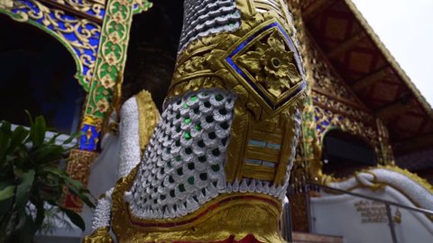 Chiang Mai, Thailand - September 2 2018: Golden Dragon Statue Decorated Shiny Silver Buddhist Temple Religious Sunrise