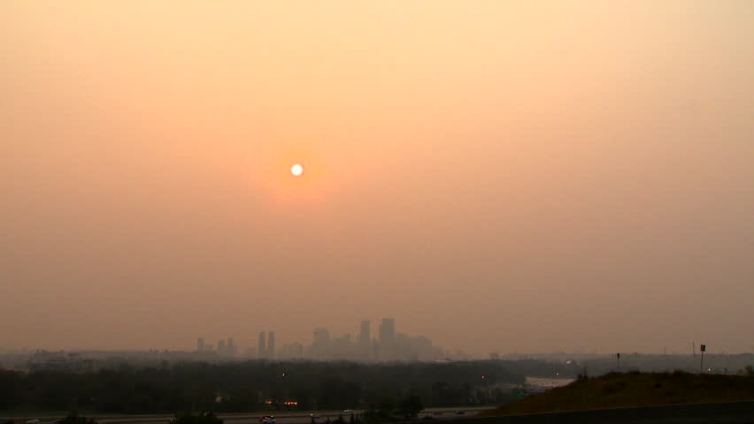 Wildfire smoke covers downtown Calgary, Alberta, Canada. Red sky hours before sunset.