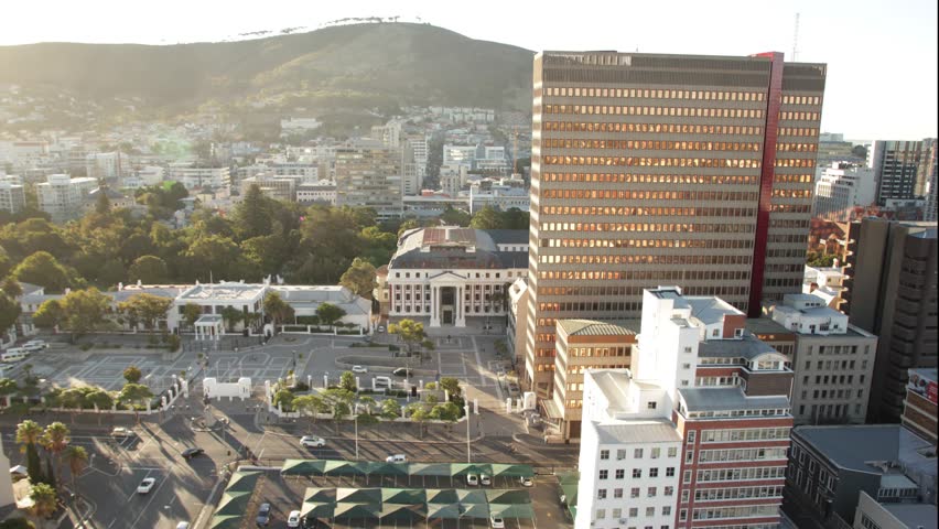 Time lapse above the city of cape town, south africa. Shot from a rooftop during the sunset. The Light is changing and cars are passing by.