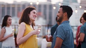 Friends Gathered On Rooftop Terrace For Party With City Skyline In Background - Powered by Shutterstock - Get 15% off with code: PIKWIZARD15