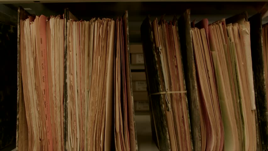 Camera movement along a file shelf. The files are old, the paper is yellowed.
The image can be used for the integration of archive texts in films and reports. Thanks to the 50 frames it can be slowed  Royalty-Free Stock Footage #1016795260