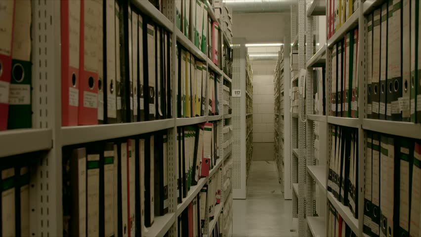 In an archive, between two shelf walls, the camera moves out.
The image can be used for the integration of archive texts in films and reports. Thanks to the 50 frames it can be slowed down.
