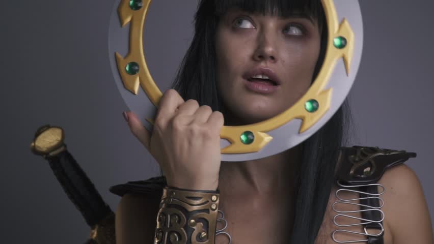 Sexy amazon pose with a battle disk, slow motion