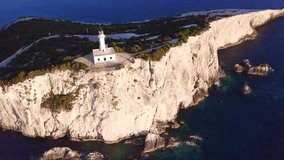 Aerial drone bird's eye view video of iconic lighthouse in Cape Lefkada the Southest part of the island, Ionian, Greece