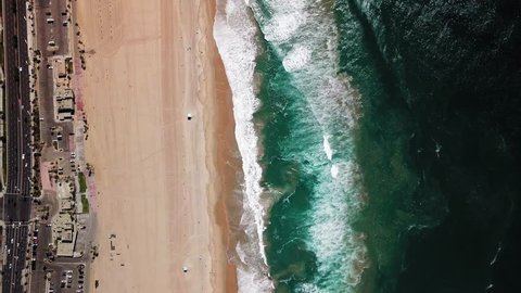  4K Drone Aerial of Huntington Beaches looking down on Pacific Ocean in California
4K Drone Aerial of Huntington Beaches looking down on Pacific Ocean in California
Aerial flyover 