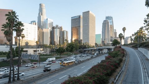 Los Angeles, California, USA - September 11th 2018 - Downtown Los Angeles Skyline and Freeway 9/11 Tribute Lights Sunset Timelapse