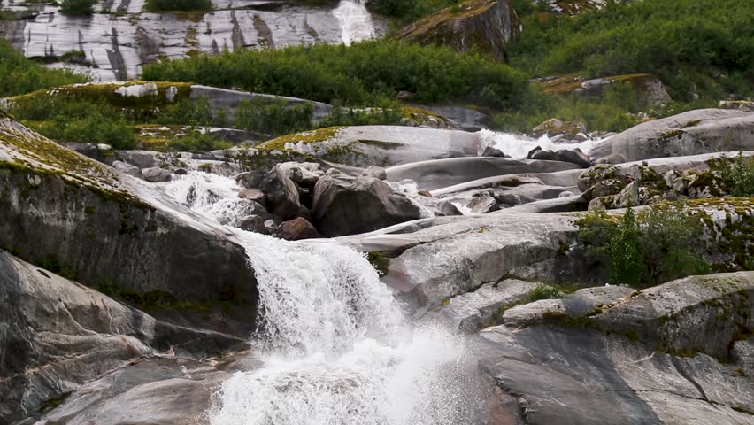 One of many beautiful waterfalls found in the protected wilderness of Endicott Arm. Alaskan natural beauty.