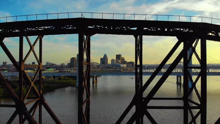 Aerial reveal of Louisville through walking bridge trusses