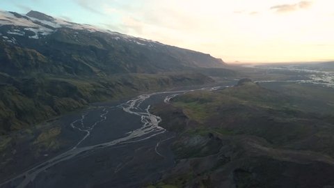 Beautiful aerial view looking over the famous Eyjafjallajokull in Thorsmork Iceland. Drone flies over the extraordinary Icelandic landscape. Big mountains, rivers dramatic valley and a glacier.