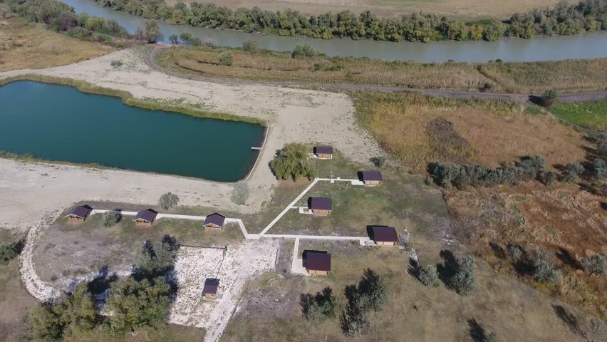 Top view of the recreation center by the river, near the sea. Hunting recreation center. tourist lodges for hunters. Lake for fishermen.