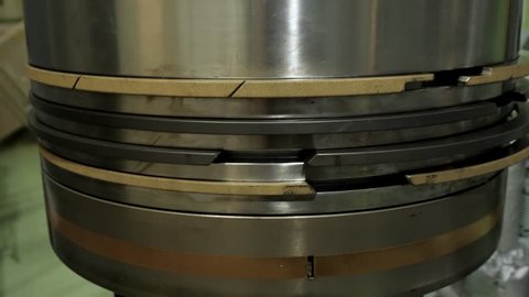 Piston of large diesel of ship with new rings close up