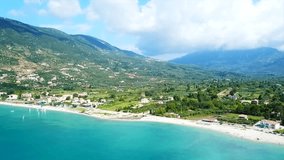 Aerial drone video of iconic seaside village and port of Vasiliki famous for trips to Ionian islands and nearby beaches, Lefkada island, Ionian, Greece