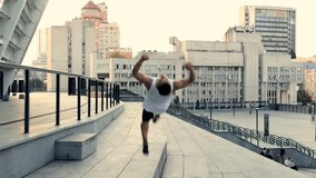 Running young man doing parkour tricks and somersaults - Powered by Shutterstock - Get 15% off with code: PIKWIZARD15