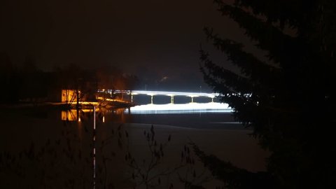 Bright garlands on traffic bridge at night. Time lapse