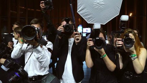 MOSCOW, RUSSIA – June, 5: Paparazzi are shooting celebrity. Slow motion. Flash light.