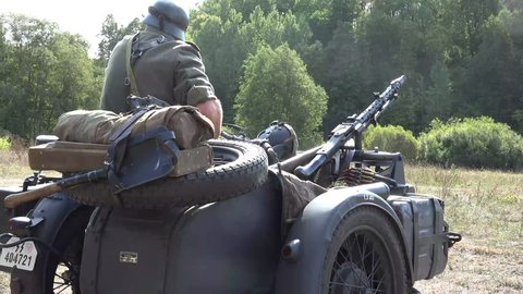 German Soldier and Wartime Military Motorcycle