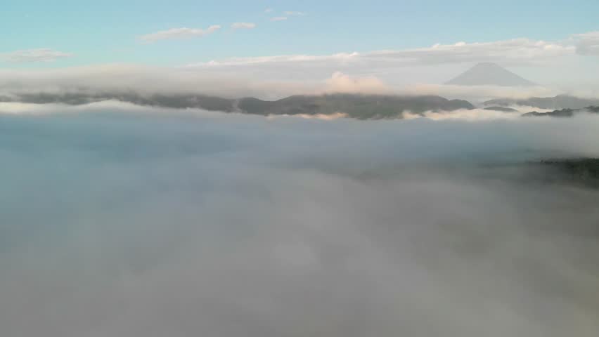 Flying above the clouds at lake Ashi and looking at mount Fuji, Hakone, Japan