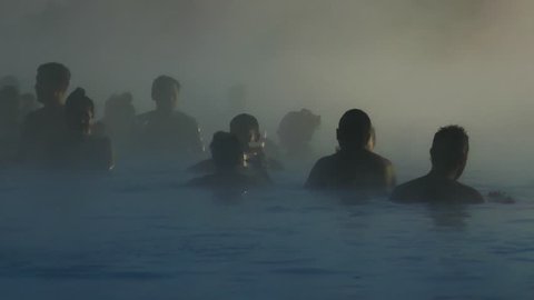 Grindavík, Iceland, January 2018: Crowd of people enjoying spa in geothermal mineral hot spring Blue Lagoon