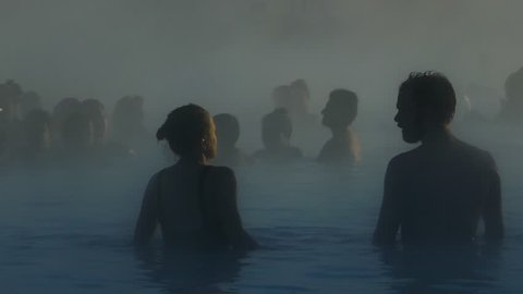Grindavík, Iceland, January 2018: Crowd of people enjoying spa in geothermal mineral hot spring Blue Lagoon