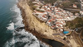 Aerial view of Azenhas Do Mar, municipality of Sintra, a seaside village on the Portuguese coast northwest of Lisbon, Portugal, shot from drone, with Atlantic Ocean view

