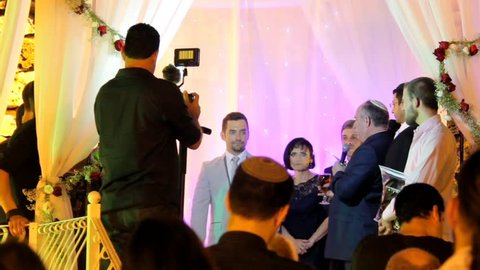 Tel Aviv, Israel - June 29, 2016: Jewish traditions wedding ceremony under chuppah