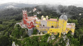 The Pena Palace, a Romanticist castle in the municipality of Sintra, Portugal, Lisbon district, Grande Lisboa, aerial view, shot from drone