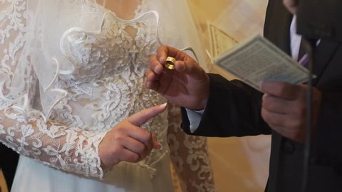 Groom gives his bride a ring - Wear Engagement Ring During Wedding Ceremony - A Jewish wedding