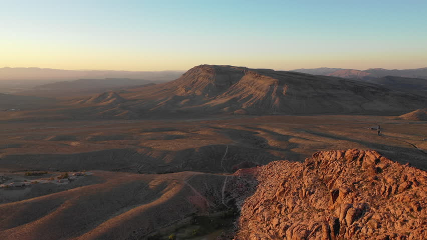 Dawn breaks on colorful mountains in Red Rock Canyon National Conservation Area, located near Las Vegas, NV. Its massive red rock geologic formations are popular for hiking and climbing.