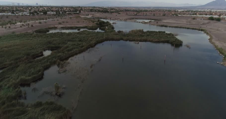 Aerial Drone Shot Flying Over Manmade Lake In Henderson Nevada