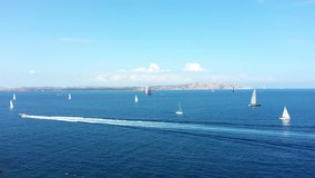 Video from above, aerial view of some yachts and sailing vessels douring a Regatta. September 2018, Sardinia, Italy. 