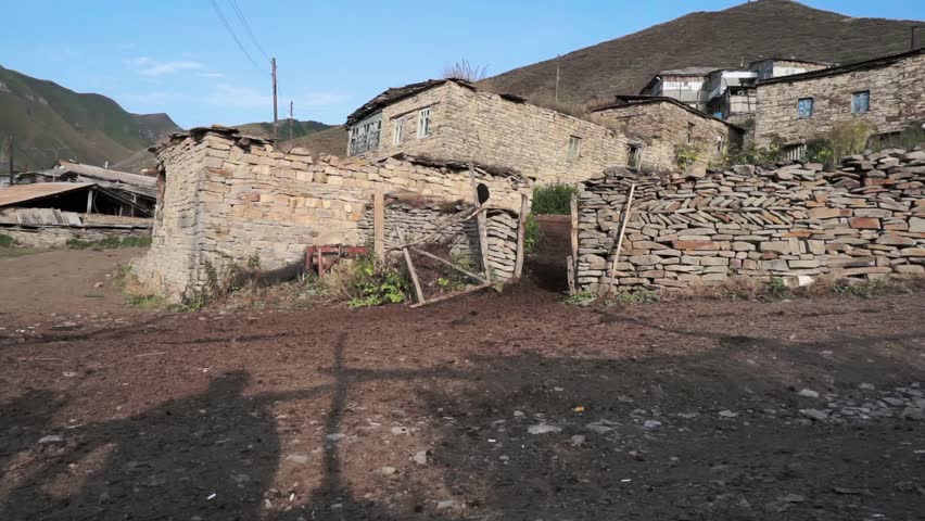 Houses of abandoned mountain village. Summer morning. Still camera