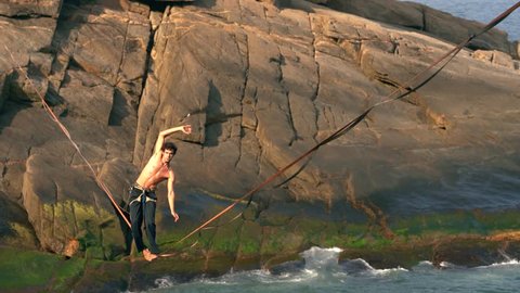  SlackLine Lifestyle in  holiday s travel Tour at the Secret dream beach Vidigal in Rio de janeiro. An place to relax and inspire creative style
