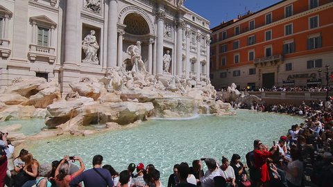 ROME, ITALY - CIRCA 2018: Crowd of people at the Trevi Fountain, a famous Baroque fountain and one of the most visited landmarks of Rome