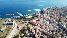 Aerial drone video of iconic and historical center of old Corfu town an UNESCO world heritage site, Kerkyra island, Greece
