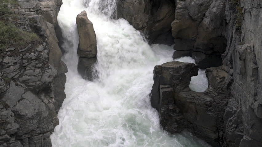 Sunshine on Sunwapta Falls. Jasper National Park. Alberta, Canada. 4K, UHD.

