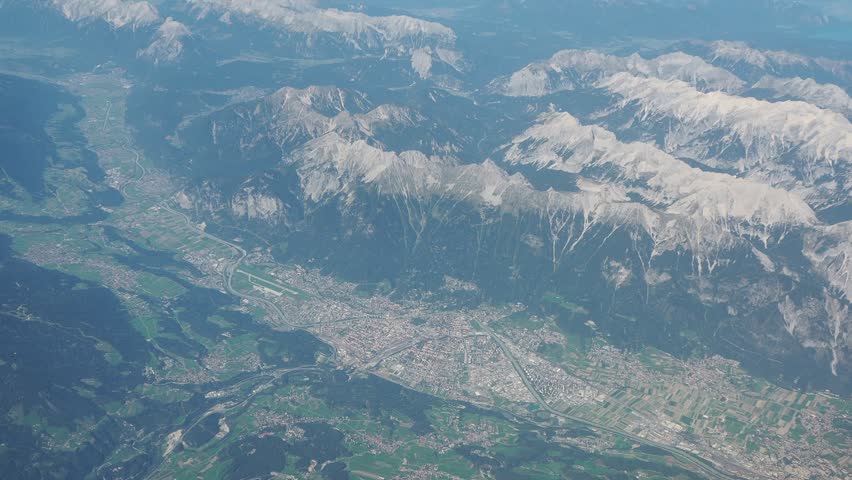 Aerial landscape at the city of Innsbruck (Austria) from the airplane window
