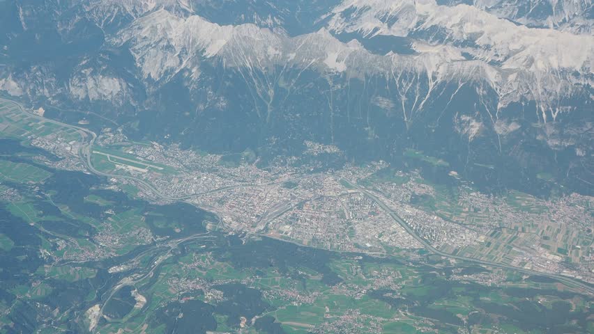 Aerial landscape at the city of Innsbruck (Austria) from the airplane window