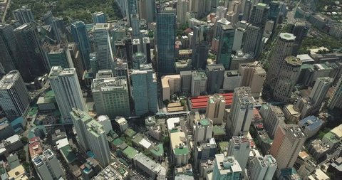 Aerial shot of Manila City descending and tilting up revealing cityscape.